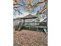 Home's backyard with wooden deck and steps at 698 Ira Sw St, Atlanta, GA 30310
