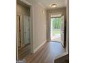 Bright foyer features wood-look flooring leading to the rest of the home at 1547 South Bethany Rd, Locust Grove, GA 30248