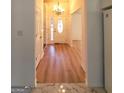 Inviting foyer with marble threshold and hardwood flooring, leading to open living areas at 4284 Caroline Ct, Douglasville, GA 30135