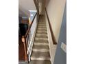 Carpeted staircase with wooden handrail at 2809 Hillside Way, Decatur, GA 30034