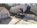 Aerial view of a well-maintained home with a spacious driveway and manicured landscaping at 5479 Dorsett Shoals Rd, Douglasville, GA 30135