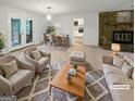 Bright living room featuring a stone fireplace, neutral furniture, and an open dining area at 120 Black Rock Ct, Fayetteville, GA 30214