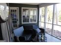 Relaxing screened porch with wicker furniture and view of backyard at 2744 Amber Springs Way, Buford, GA 30519