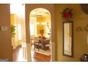 Bright dining room with hardwood floors and a view into the kitchen at 80 Tanners Ct, Covington, GA 30016