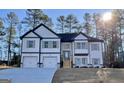 Two-story house with a two-car garage and a landscaped yard at 3278 Greenhill Dr, Villa Rica, GA 30180