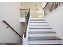 Elegant staircase with dark wood treads and white risers at 3278 Greenhill Dr, Villa Rica, GA 30180