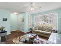 Living room with light walls and neutral furniture at 103 Odyssey Turn, Conyers, GA 30012