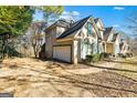 Home's side view, showing garage and driveway at 232 Terrane Rdg, Peachtree City, GA 30269