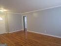Hardwood floors and neutral walls in living room at 423 Center Sw Cir, Conyers, GA 30094
