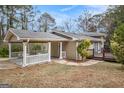 Charming home featuring a covered carport and private back deck at 3435 Misty Valley Rd, Decatur, GA 30032