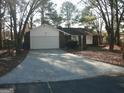 Brick ranch home with attached garage and driveway at 295 Adena W Ln, South Fulton, GA 30349