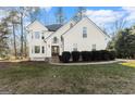 Two story house with white exterior, stone accents, and landscaping at 2160 Robin Hood Trl, Cumming, GA 30040