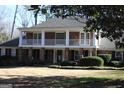 Two-story home with balcony and landscaping at 5651 Bahia Mar Cir, Smoke Rise, GA 30087