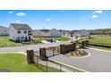 Shoal Creek community entrance with gate and landscaping at 11996 Conrad Cir # 128, Hampton, GA 30228