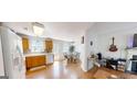 Bright kitchen featuring wood cabinets, stainless steel appliances, and hardwood floors at 15 Huntington Dr, Grantville, GA 30220