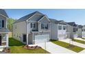 Two-story house with gray siding, and a two-car garage at 12116 Conrad Cir # 114, Hampton, GA 30228
