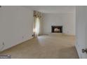 Spacious living room with a brick fireplace and large window at 2145 Sandgate Cir, South Fulton, GA 30349