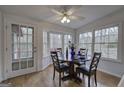Bright breakfast area with table, chairs, ceiling fan and hardwood floors at 731 Willow Ridge Dr, Marietta, GA 30068