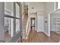 Bright entryway with hardwood floors and a staircase leading to the second floor at 102 Morallion Hls, Peachtree City, GA 30269