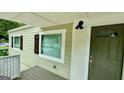 Updated front entrance with a green door and white brick at 1222 Bronx Nw St, Atlanta, GA 30314