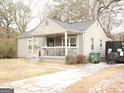 Ranch style home with covered porch and large yard at 561 Commercial Nw Ave, Atlanta, GA 30318