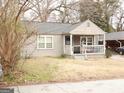 Ranch style home with covered porch and street view at 561 Commercial Nw Ave, Atlanta, GA 30318