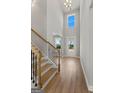 Bright entryway with hardwood floors, staircase, and high ceilings at 172 Austin Dr, Mcdonough, GA 30252