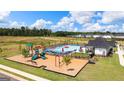 Aerial view of community pool, playground, and clubhouse at 157 Aster Ave # 181, Locust Grove, GA 30248