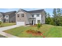 Charming two-story home featuring a brick and siding exterior with a well-maintained front lawn at 157 Aster Ave, Locust Grove, GA 30248