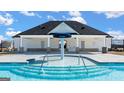 Community splash pool with brick and white building; great for relaxing and cooling off at 157 Aster Ave, Locust Grove, GA 30248