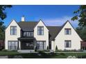 Rear view of a two-story home with brick exterior, metal roof, and landscaping at 0 Matteo Way # 20, Fayetteville, GA 30215