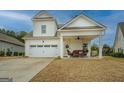 Beautiful home with a covered patio, two-car garage, and well-maintained lawn at 4128 Pemberton Dr, Covington, GA 30014