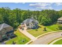 An aerial view displays this home's proximity to neighboring houses in a well-maintained community at 4051 Rotterdam Pass, Hampton, GA 30228