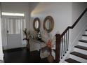Bright and airy entryway with dark hardwood floors at 4051 Rotterdam Pass, Hampton, GA 30228