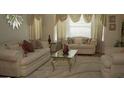 Spacious living room with beige sofas and a coffee table at 4768 Redbranch Rd, Decatur, GA 30035