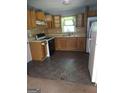 Functional kitchen features appliances and wood cabinets at 1551 Ferno Nw Dr, Atlanta, GA 30318