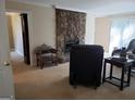 Living room featuring a stone fireplace and comfortable seating at 4767 Glenwhite Dr, Duluth, GA 30096