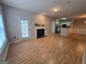 Bright living room with fireplace and laminate wood floors at 101 Spring Heights Ln, Smyrna, GA 30080