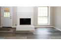 Living room with white brick fireplace at 3130 Mars Hill Rd, Acworth, GA 30101
