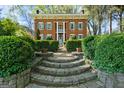 Brick home with stone steps and lush landscaping at 3115 Pennington Sw St, Covington, GA 30014