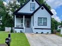 Two-story house with white siding, black accents, and a well-maintained lawn at 78 Bisbee Se Ave, Atlanta, GA 30315