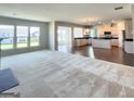 Open concept kitchen with island and stainless steel appliances at 212 Himalaya Way, Mcdonough, GA 30253