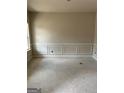 A room with custom wall trim ready for paint at 115 Yancey Rd, Covington, GA 30014