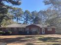 Red brick ranch house with a spacious yard at 5324 Crystal Ln, Atlanta, GA 30349