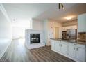 Kitchen features white cabinets, granite countertops, and a fireplace at 13 Forest Ridge Ct, Sandy Springs, GA 30350