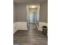 Bright hallway with gray walls, white trim, and gray flooring at 6022 Centennial Run, Atlanta, GA 30349