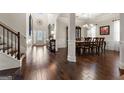 Formal dining room with hardwood floors and elegant light fixture at 801 Carnegie Ct, Locust Grove, GA 30248
