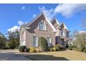 Brick house with a large front yard and mature trees at 3443 Pinemont Dr, Douglasville, GA 30135