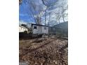 Small cottage with a yard needing landscaping at 1093 Smith Sw St, Atlanta, GA 30310