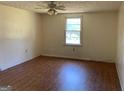 Spacious bedroom with wood floors and window at 200 Eleanor Dr, Covington, GA 30016